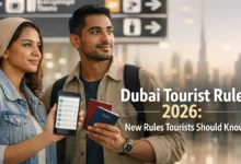 Tourists at Dubai airport holding passports and a travel checklist for Dubai tourist rules 2026