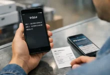 Buyer checking phone IMEI number in a mobile shop in Pakistan before PTA approval and tax status verification
