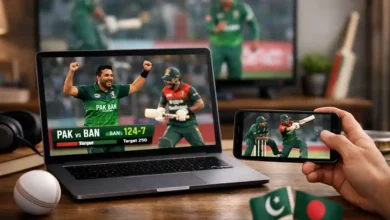Laptop and smartphone showing Pakistan vs Bangladesh cricket highlights in a modern home viewing setup